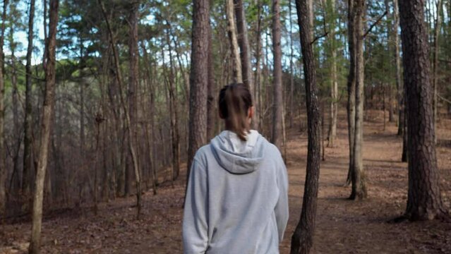 Young woman walking in Northwest woods