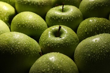 Ripe green apples with water drops as background, closeup