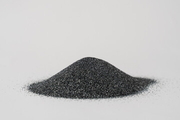 Silicon carbide abrasive powder for leveling stones isolated on white background. Silicon carbide for restore stones to original flatness.