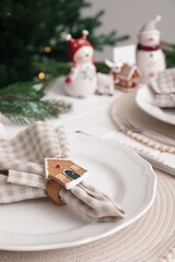 Luxury place setting with beautiful festive decor for Christmas dinner on white table, closeup