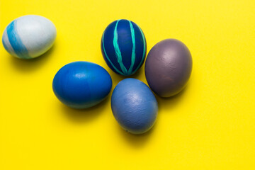 Blue Easter Eggs on yellow background