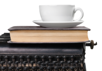 Vintage and Retro typewriter with book and cup