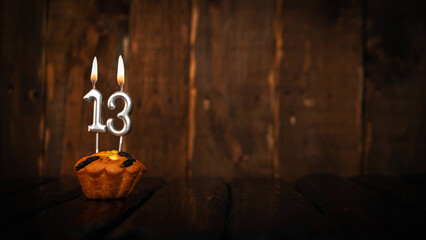 Festive background happy birthday copy space. Anniversary background with cypher and muffin. Beautiful brown from vintage boards background before a birthday with a number  13