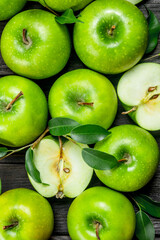 Juicy green apples with leaves.