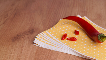 Pepper plasters and chili on wooden table, closeup. Space for text
