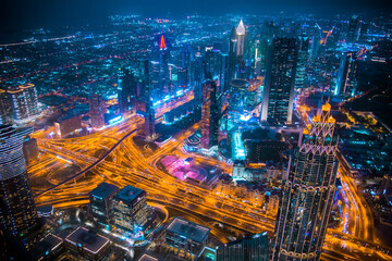 Fototapeta na wymiar Dubai city at night, view with lit up skyscrapers and roads. Dubai, UAE 2022