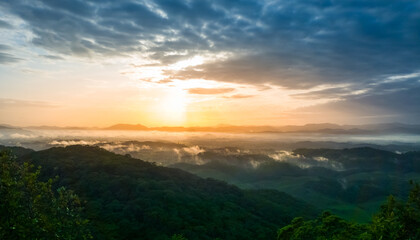 Fototapeta na wymiar Morro da antena, Gaspar, Santa Catarina, SC, nascer do sol, sol entre nuvens, neblina no morro, vista da cidade, panorama