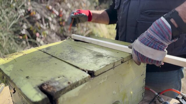 Man Measuring And Makring Wood Before Cutting 