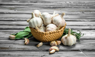 Garlic in basket with leaves.