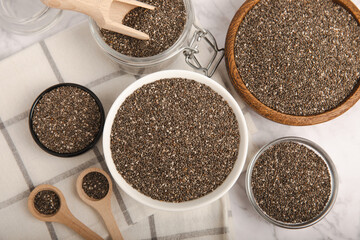 Chia seeds in bowl and spoons on white wood texture. Diet food. Superfood. Healthy food. Space for text, copy space