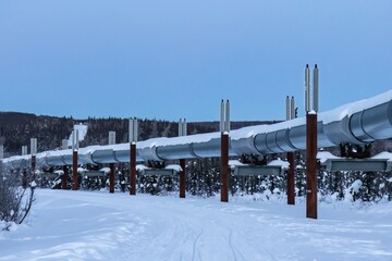 Alaskan oil pipeline through snowy artic tundra near Fairbanks, Alaska in winter