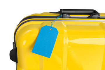 Colored travel suitcase with a blank tag. Travel concept