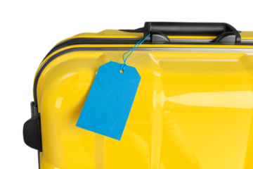 Colored travel suitcase with a blank tag. Travel concept
