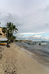 Fishing boats on the white coast of the Caribbean Sea in Playa Del Carmen.