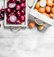 Whole and half onions in the box and on the tray.