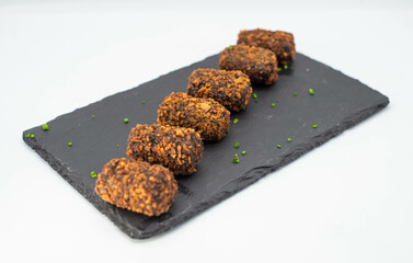 Portion of gourmet chicken, seafood and ham croquettes