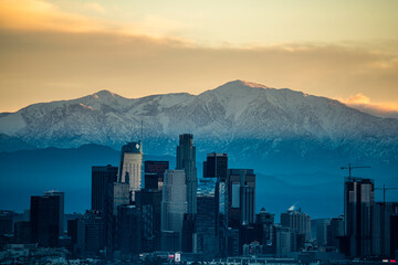 Los Angeles Skyline Contrasts Snow Capped Mountains © Cavan