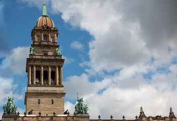 Bell tower of the Wayne County Building, a monumental government structure completed in 1902, as seen from Cadillac Square Park in downtown Detroit, Michigan. Shot on a sunny autumn afternoon.