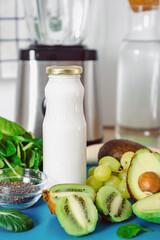 Making a healthy green smoothie from fruits and vegetables. Diet, healthy eating, vegan food.