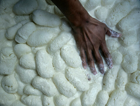Indian sweets being made at dawn in the Old City of Bikaner, Rajasthan, India.