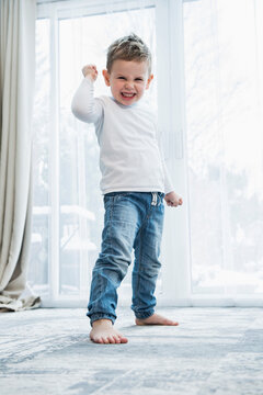 portrait of angry little boy with raised fist
