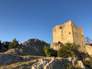 Fototapeta na wymiar Ruins of old mediaval castle of Bargeme in the warm evening light, Provence, Var, France