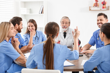 Doctor and interns on lecture in university