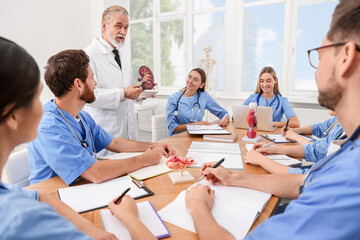 Doctor giving lecture for interns in university