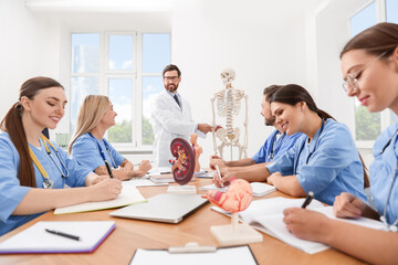 Doctor giving lecture for interns in university