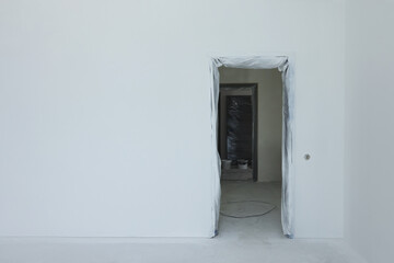 Entrance in room with fresh painted walls