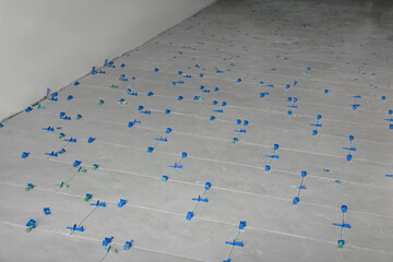 Beautiful tiles with colorful wedges on floor near wall