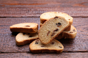 Sweet hard chuck crackers with raisins on wooden table