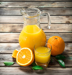 Naklejka na ściany i meble Orange juice in the pitcher.