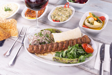 Fototapeta na wymiar traditional turkish kebap with vegatables adana kebab urfa kebab