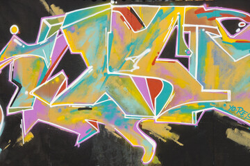 Colorful background of graffiti painting artwork with bright aerosol strips on metal wall. Old...