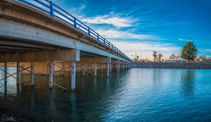 Bataan Memorial Bridge over the tranquil Lake Carlsbad, the Lower Transill Lake of Pecos River in Eddy County, New Mexico, USA