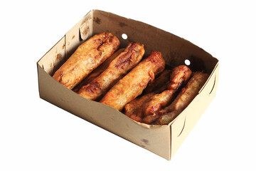 Pisang goreng or banana fritter or fried banana served in brown box, isolated on white background