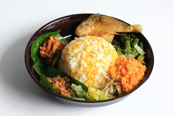 Nasi Jagung or Sego Jagung is traditional Indonesian food : rice cooked with dried corn, served with coconut vegetable salad, crunchy salted fish, and spicy sambal, isolated in white background.