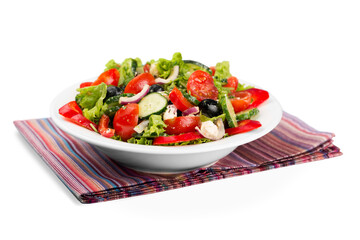 Close-up photo of fresh salad with vegetables in white plate