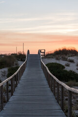 Sunset over the sand dunes. Beach boardwalk, Praia de Esmoriz, Portugal. 