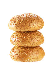 Stacked hamburger buns with sesame seeds isolated on white background