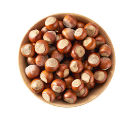 Hazelnut in a wooden bowl, top view. Nut hazelnuts in a wooden bowl isolated on white background.