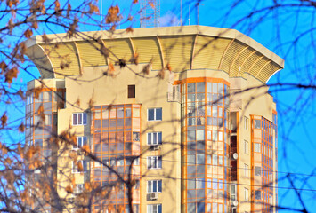 Fragment of the facade of a multi-storey residential building on a winter day