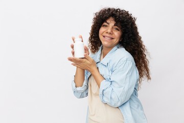 Pregnant woman smile with a jar of prenatal vitamin tablets in her hands, alpha lipoic acid, vitamin complex