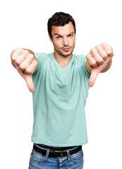 Fototapeta premium Thumbs down, man and studio portrait, white background and isolated for wrong sign, poor review or body language. Disappointed guy, hands and bad opinion, rejection emoji and hate feedback of failure