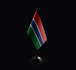 Small national flag of the Gambia on a black background