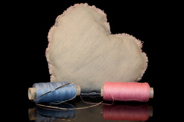 beautiful heart made of denim fabric on a black background