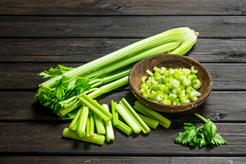Pieces of celery in a wooden bowl.