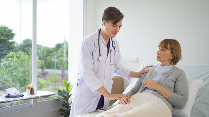 Obraz premium Portrait of caucasian doctor check up body of sick patient on bed in hospital in medical and healthcare treatment at nursing home or clinic. People lifestyle