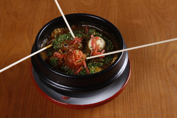 japanese stew with fish and pork balls in a bowl
